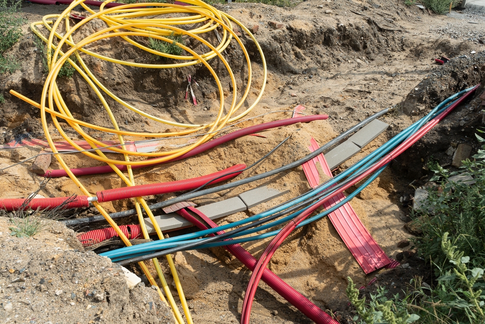 Network,Cables,In,Red,Corrugated,Pipe,Are,Buried,Underground,On